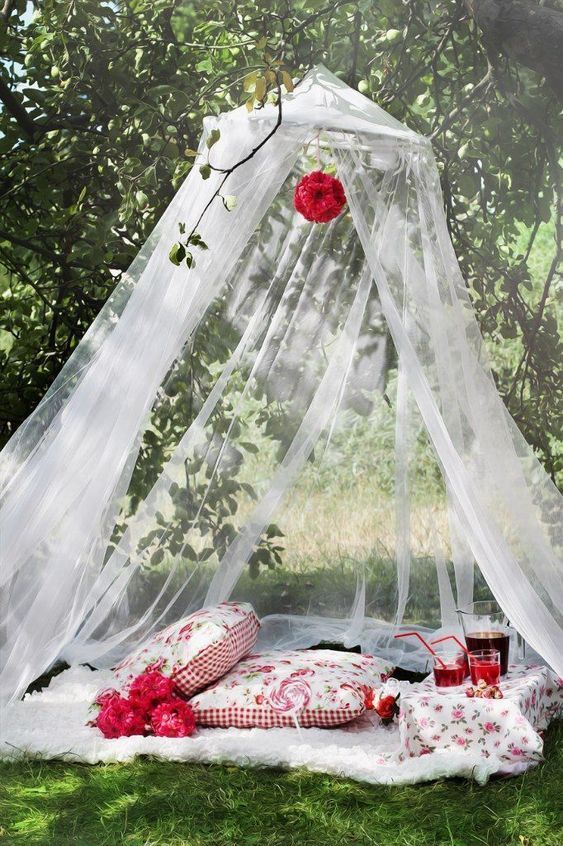 A softly draped canopy with a romantic floral detail